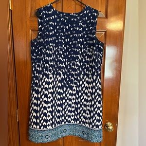 Sleeveless navy blue and white dress with multicolored border